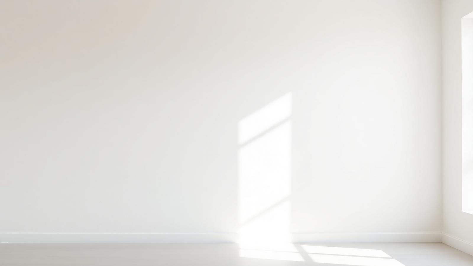 A smooth finished wall lit from the side so the surface flatness is visible